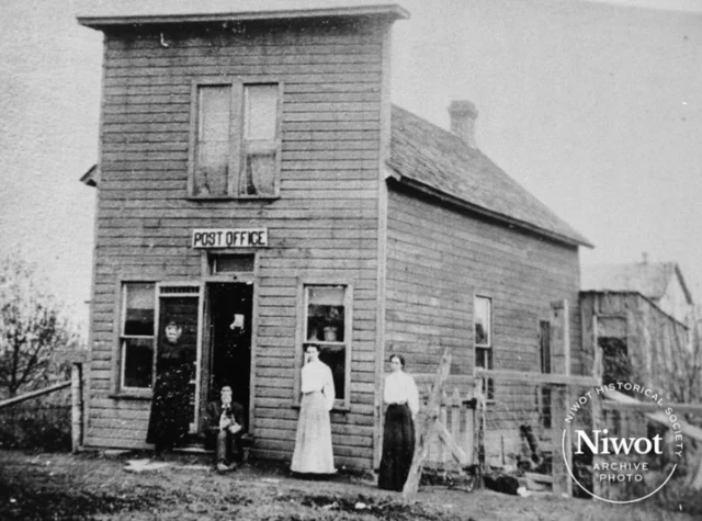 Niwot Historic Photo Series | Niwot Post Office 📮📬

Left to Right: Postmaster Julia Stockley, husband Delevan Stockley, daughters Annie and Amy (dark skirt). One was a nurse, the other a teacher. Building stood on Murray Street where present post office now stands. Date of Photo: 1907

Interior of Niwot Post Office, Verla Johnson at the counter. ca 1919

Niwot Post Office ca. 2020

_______
 📜 This year our town is celebrating its 150th Anniversary, or Sesquicentennial. This milestone marks the recording of the town plat of Niwot by Ambrose Murray and Porter Hinman on March 30, 1875.

#niwot #niwotcolorado #niwotsesquicentennial #coloradohistory #boulderhistory #nativehistory #americanhistory #postofficehistory #uspshistory #historicpostoffice